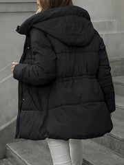 Person wearing a black puffer jacket on a staircase