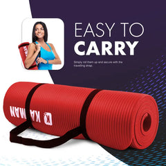 Red yoga mat with carrying strap and woman holding it on a dark blue background
