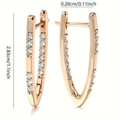 Rose gold hoop earrings with diamond accents and measurements on a white background