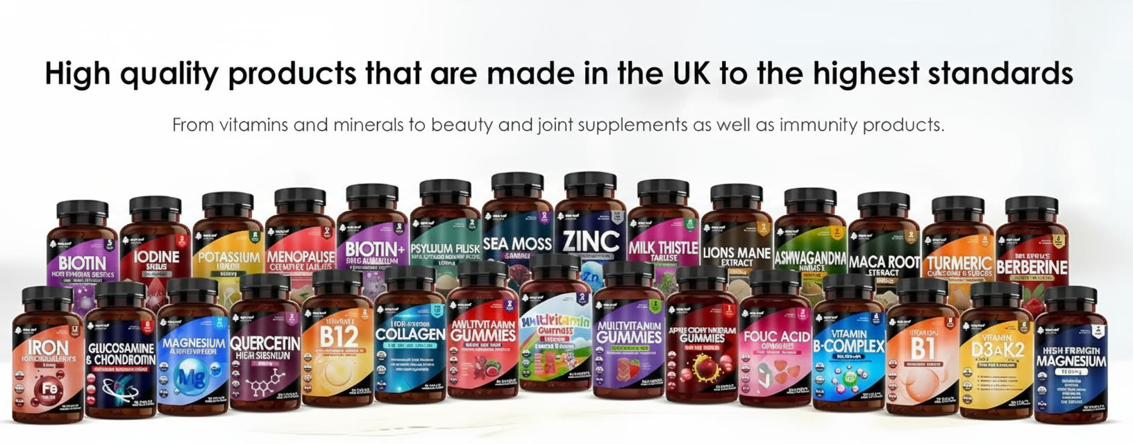 Row of various supplement bottles with labels on a white background